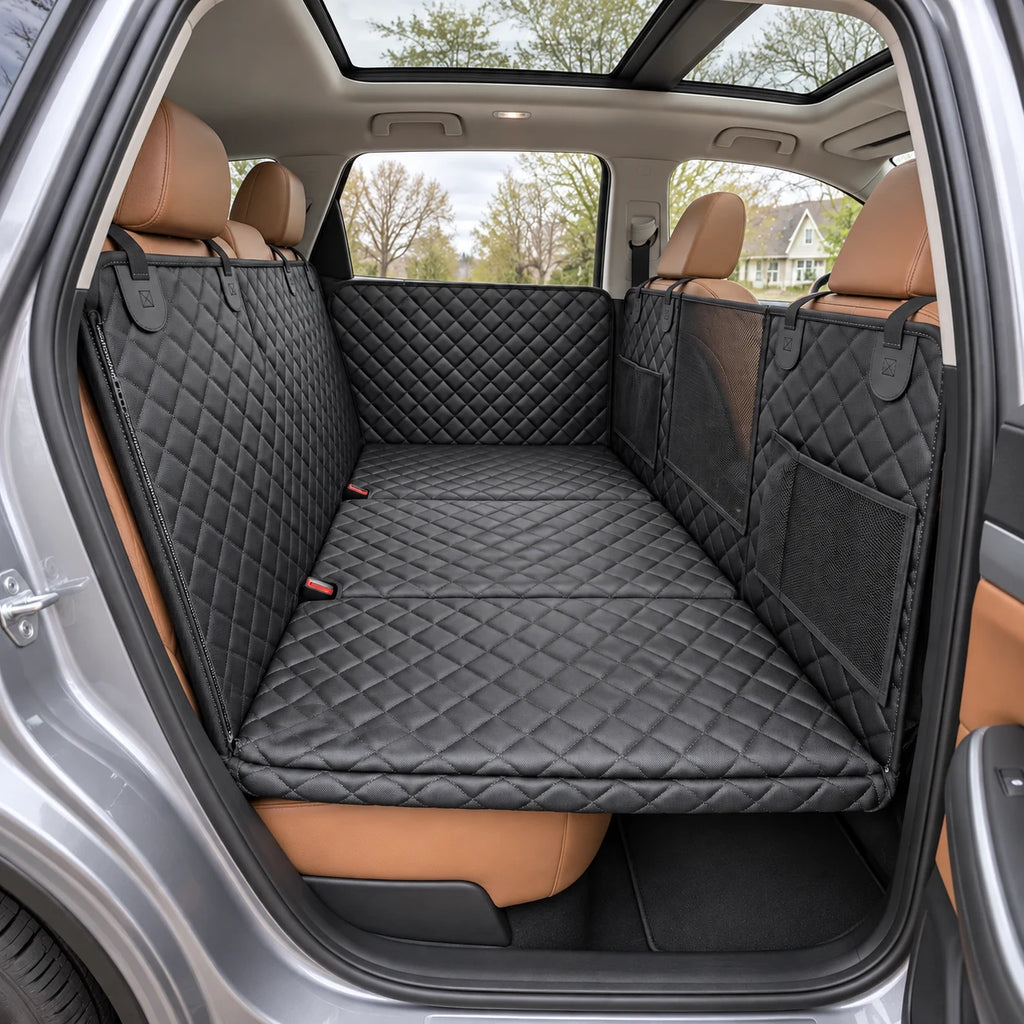 Black quilted hammock installed across the rear bench with seat-belt openings accessible